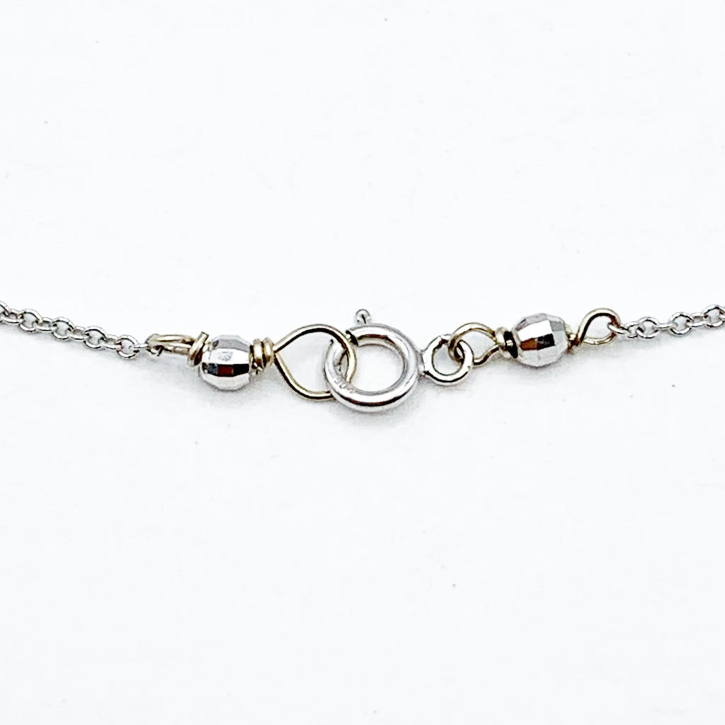 Delicate White Gold Beads Linked in a Golden Chain