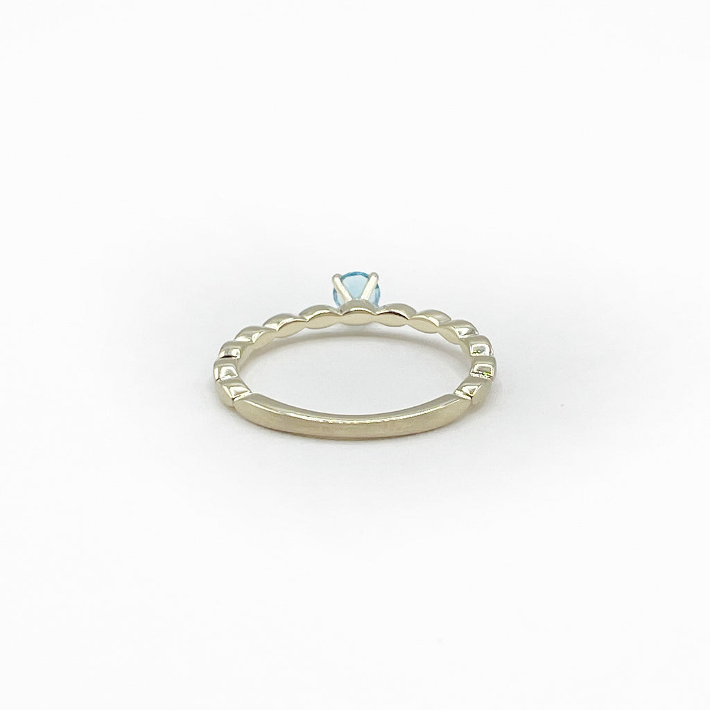 Blue Topaz Princess Ring on a Band of Tiny Pillows