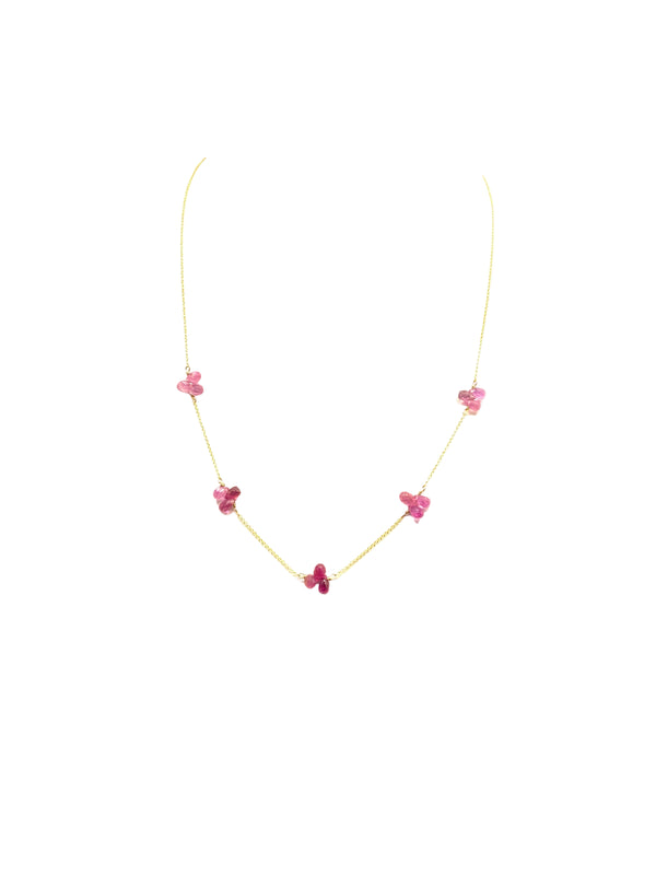 Necklace with pink floral pendants on a white background