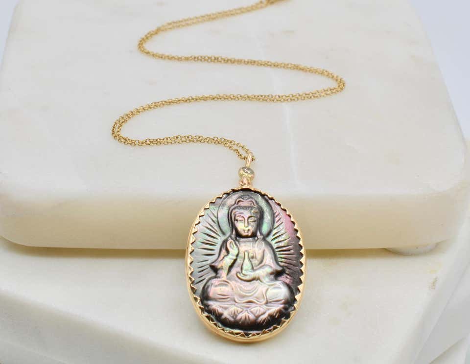 Mother of Pearl Buddha Set in 14 Karat Gold with Diamond Bale Necklace