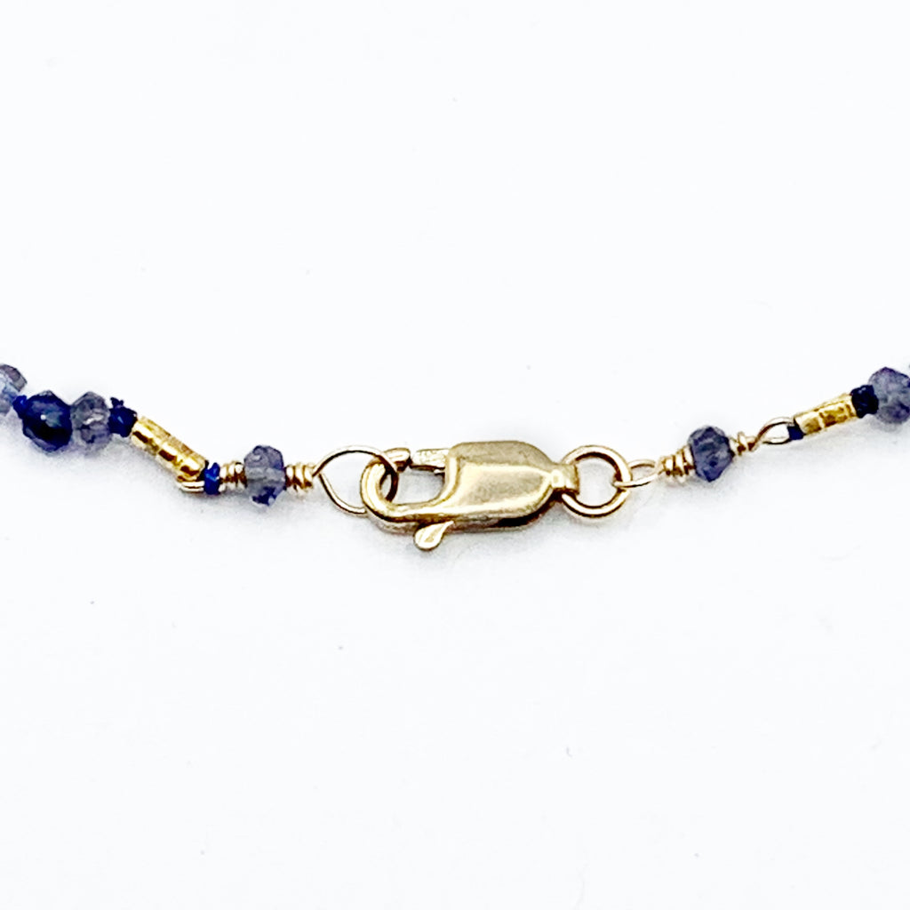 Deep Blue Beads with a Golden Sun Disk