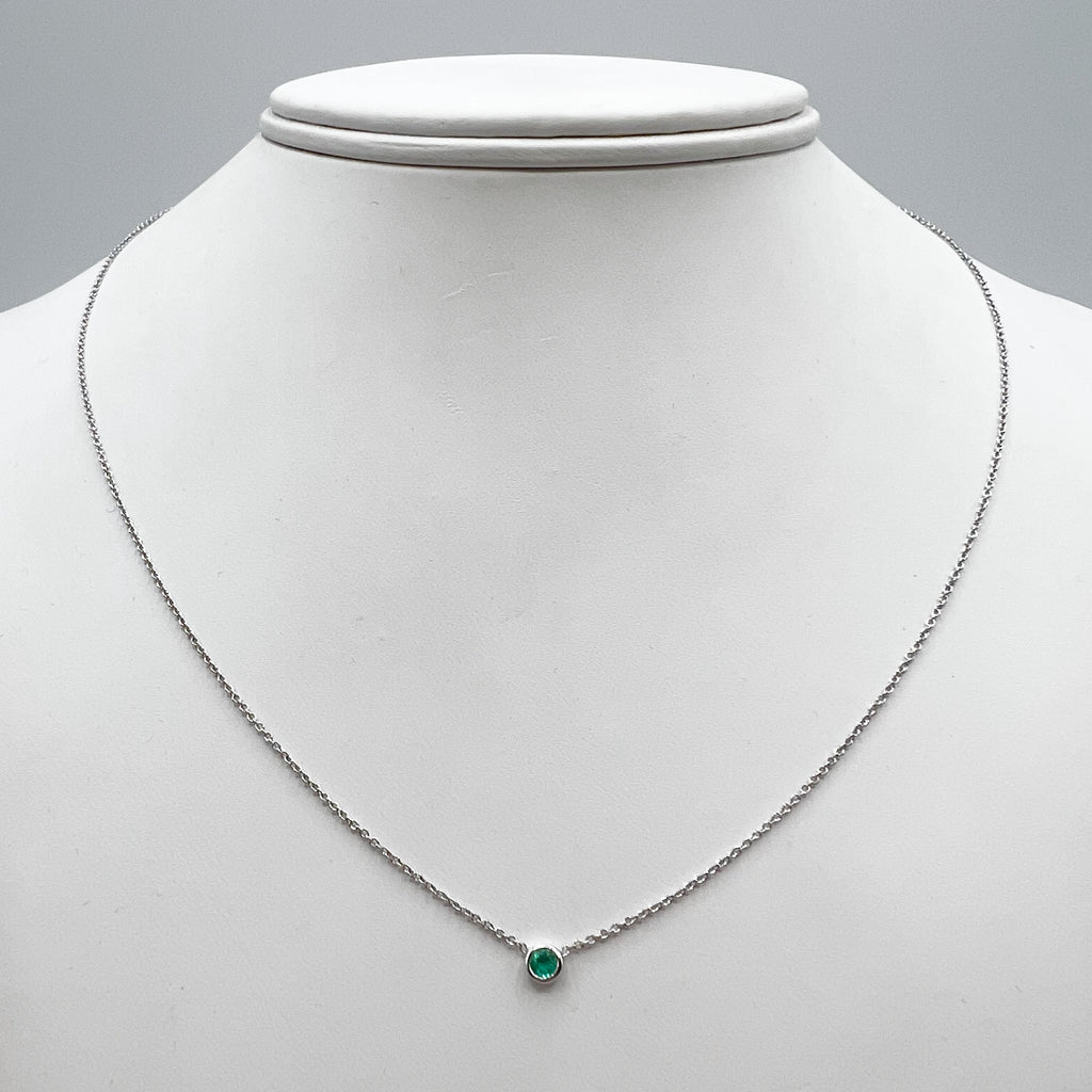 Bright Green Emerald on Shimmering White Gold