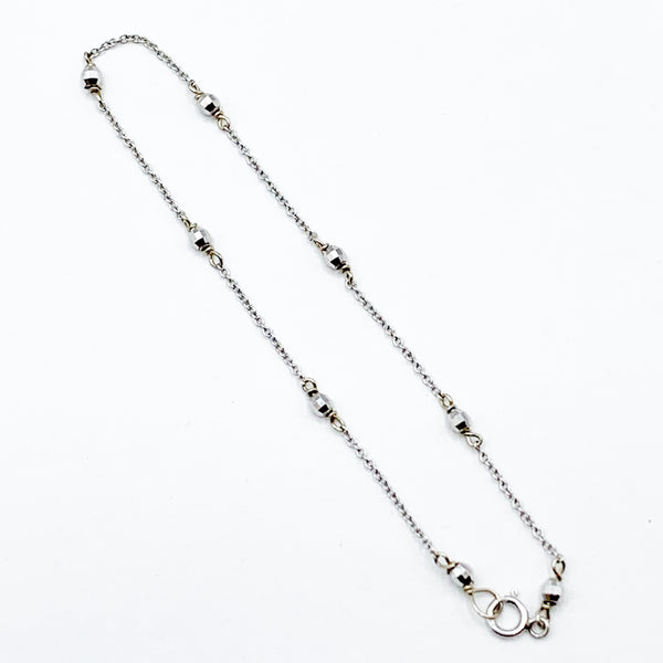 Delicate White Gold Beads Linked in a Golden Chain