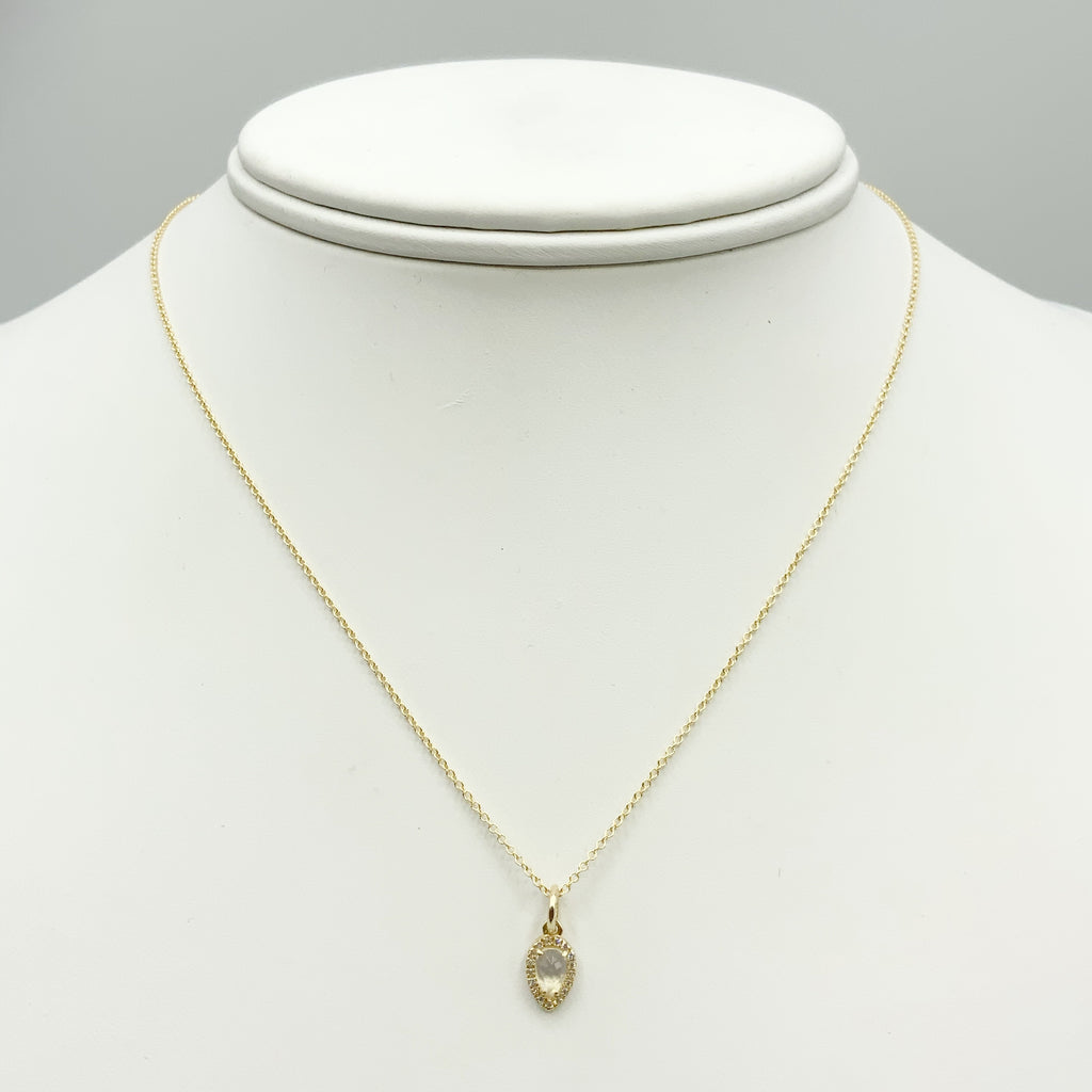 Soft White Teardrop Moonstone Surrounded by Diamonds