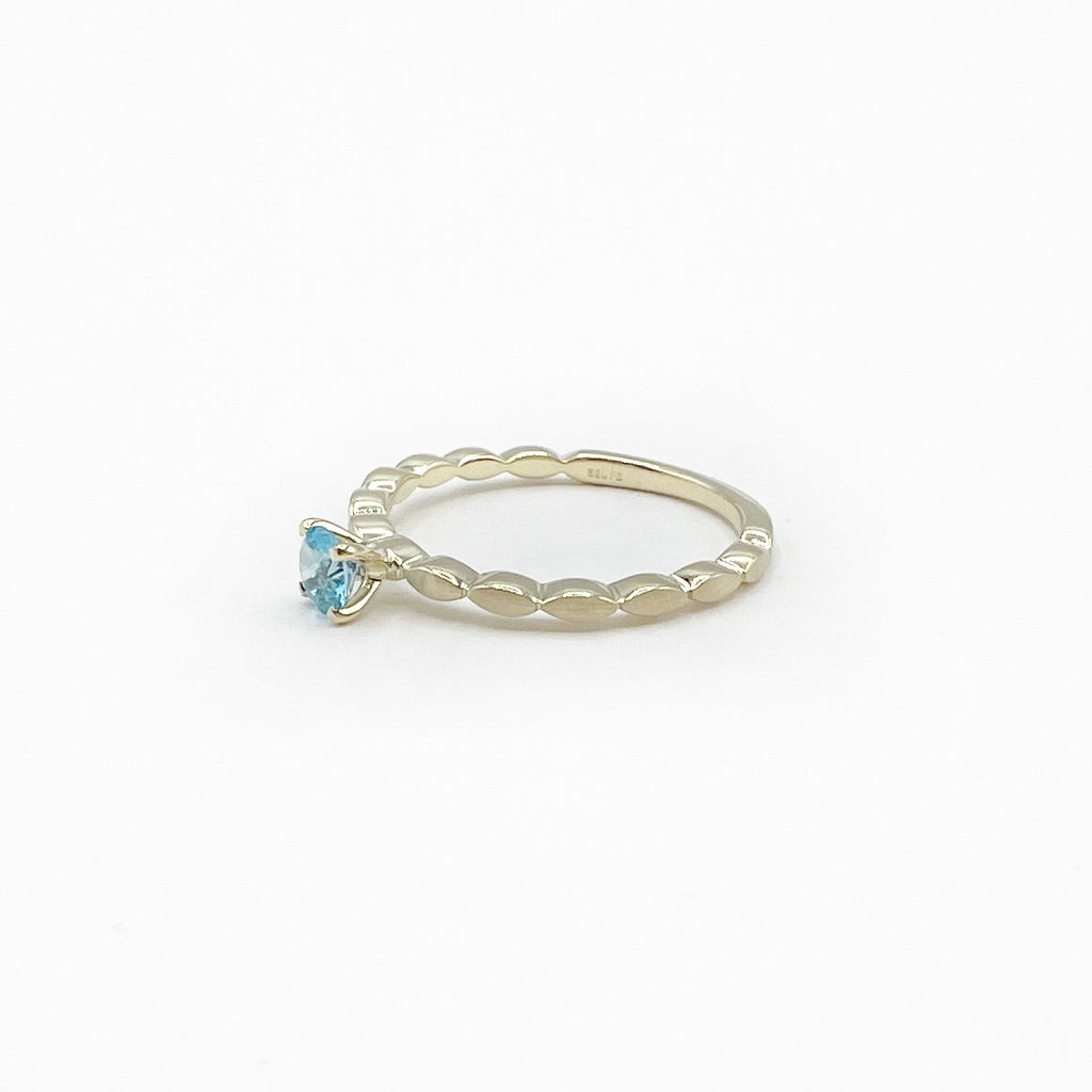 Blue Topaz Princess Ring on a Band of Tiny Pillows