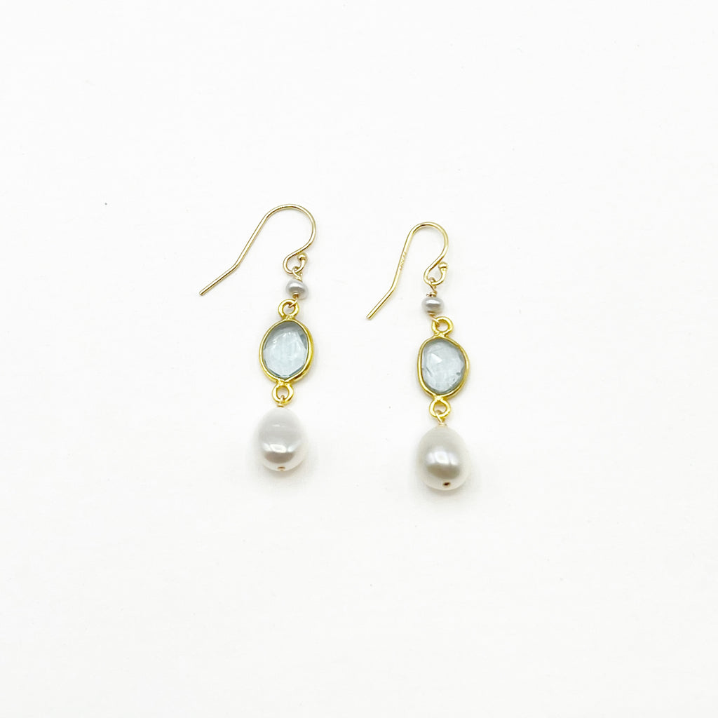 Light Blue Topaz and Pearl set in Gold