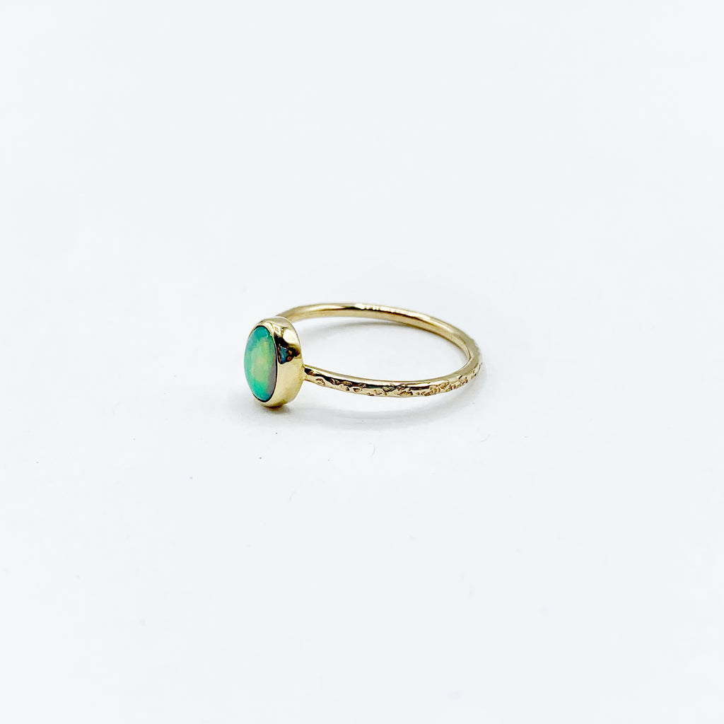 Exquisite Oval Opal on a Golden Circle