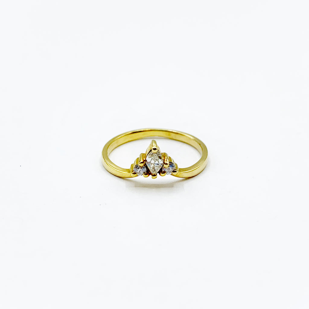14 Karat Yellow Gold Ring With One Marquise Shape Diamond And Two Round Shape 0.10 Total Weight