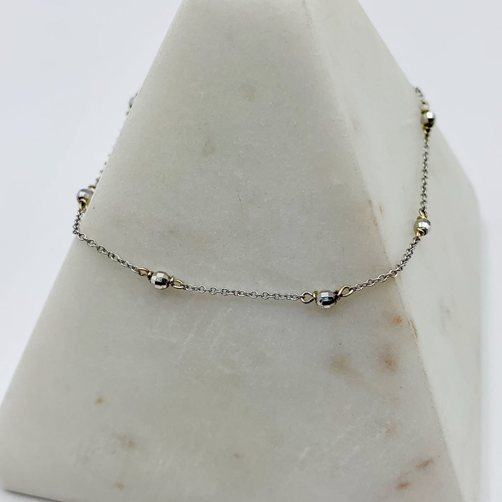 Delicate White Gold Beads Linked in a Golden Chain