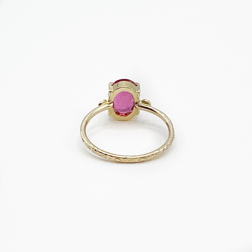 Oval Rubilite Tourmaline set in 14 Karat Yellow Gold with Diamonds