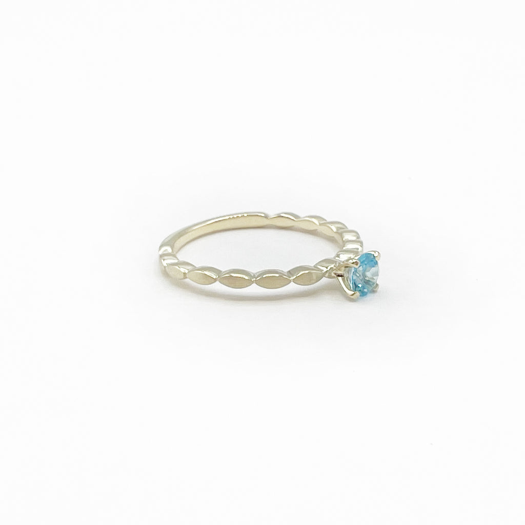 Blue Topaz Princess Ring on a Band of Tiny Pillows