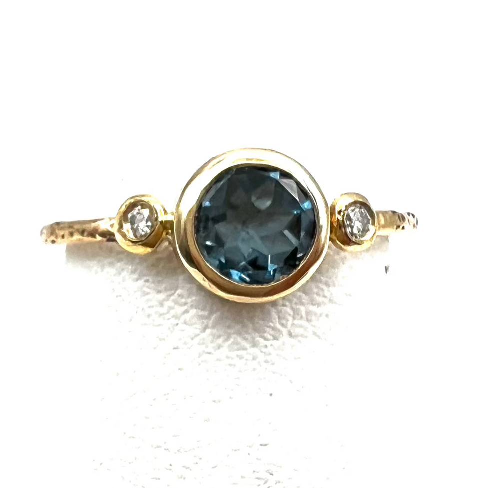 Montana Sapphire Ring With Round Diamonds in 14 Karat Yellow Gold with Textured Band.