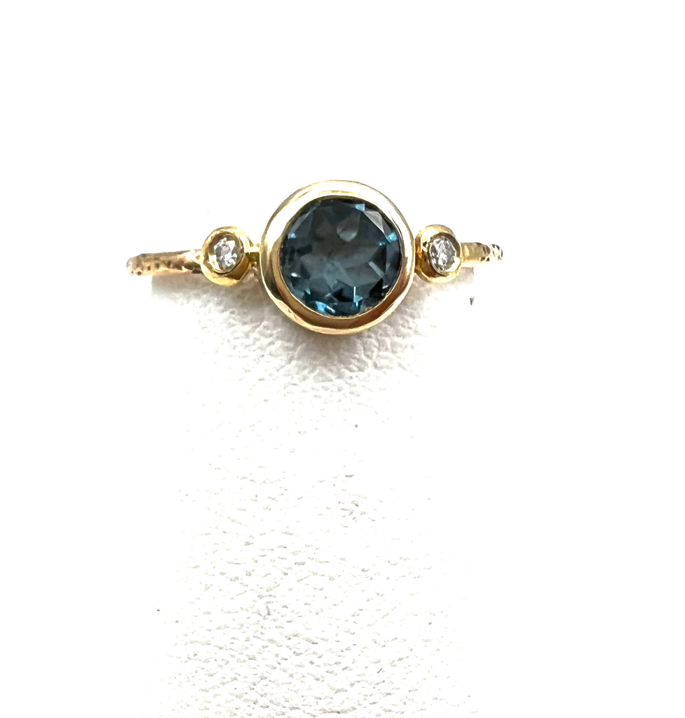 Montana Sapphire Ring With Round Diamonds in 14 Karat Yellow Gold with Textured Band.