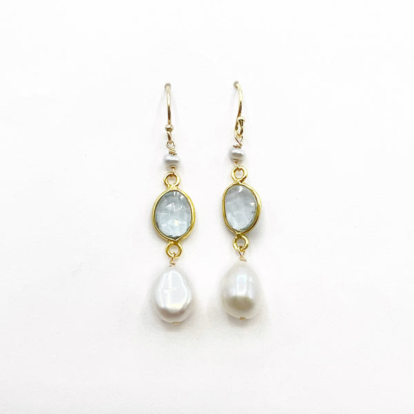 Light Blue Topaz and Pearl set in Gold